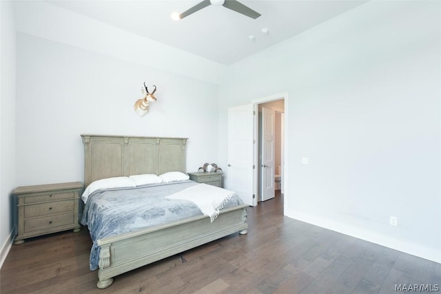 bedroom with ceiling fan and dark hardwood / wood-style flooring