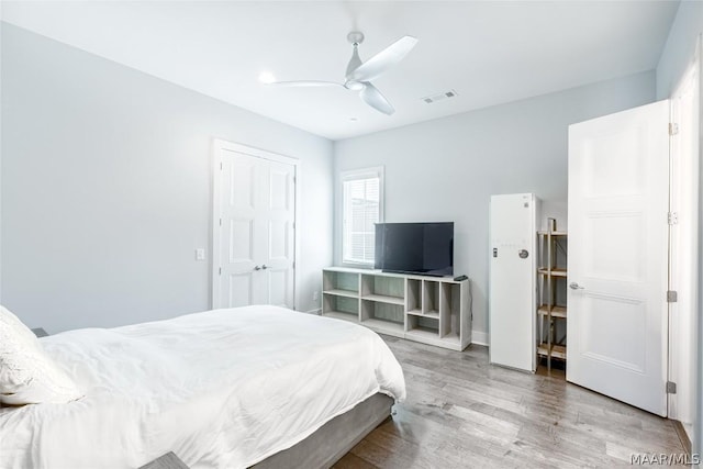 bedroom featuring hardwood / wood-style floors and ceiling fan