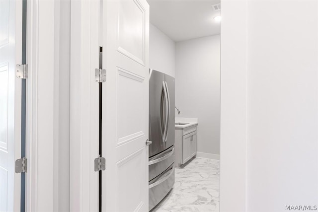 clothes washing area featuring sink