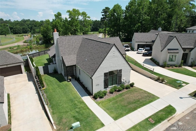 view of front of home with a garage and a front lawn