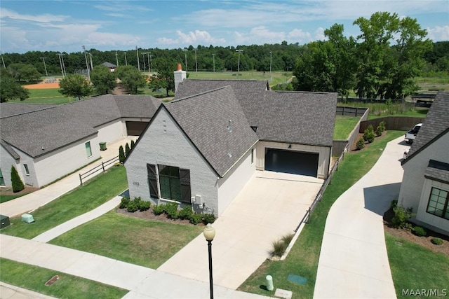 view of front of house with a garage and a front yard