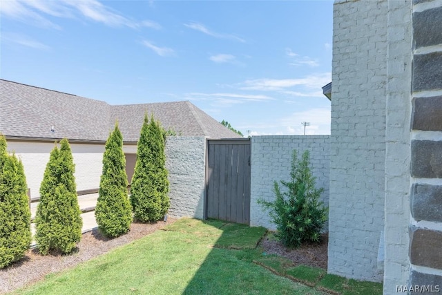 view of property exterior featuring a lawn