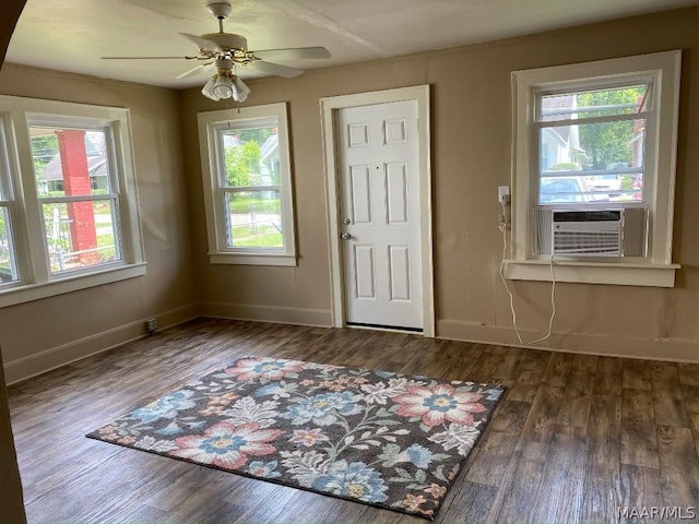 entryway featuring ceiling fan, dark hardwood / wood-style floors, and a healthy amount of sunlight