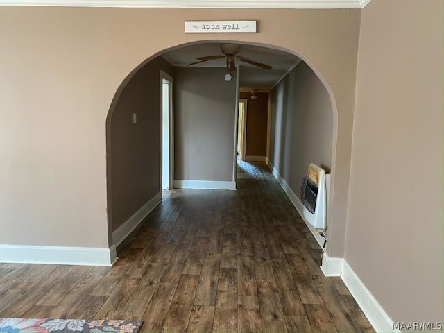 hall with dark hardwood / wood-style flooring and heating unit