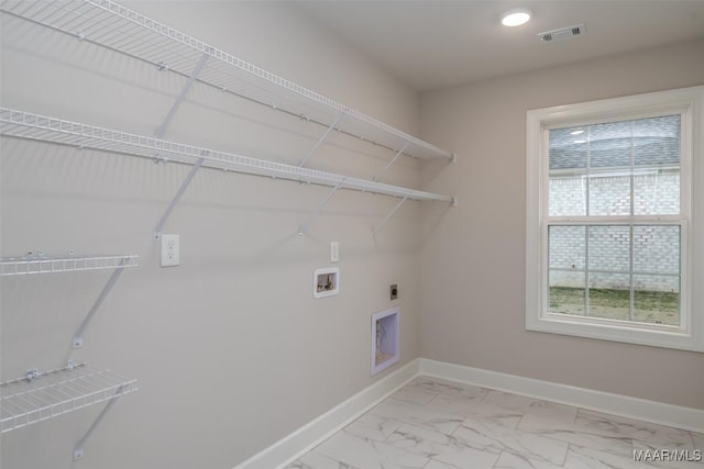 laundry area featuring washer hookup, marble finish floor, visible vents, laundry area, and baseboards