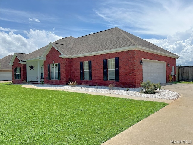 view of front facade with a garage and a front lawn