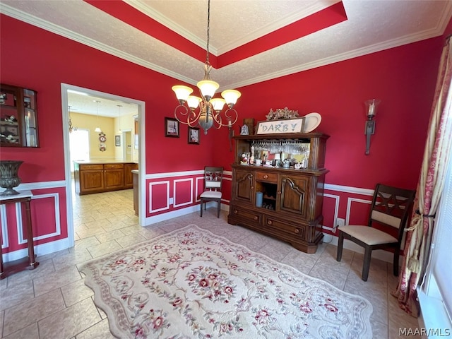 dining room with light tile patterned floors, crown molding, a textured ceiling, and a chandelier