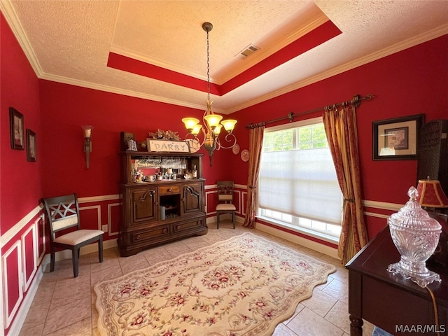 sitting room with an inviting chandelier, crown molding, a raised ceiling, and light tile patterned flooring