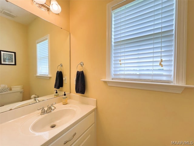 bathroom with vanity and toilet