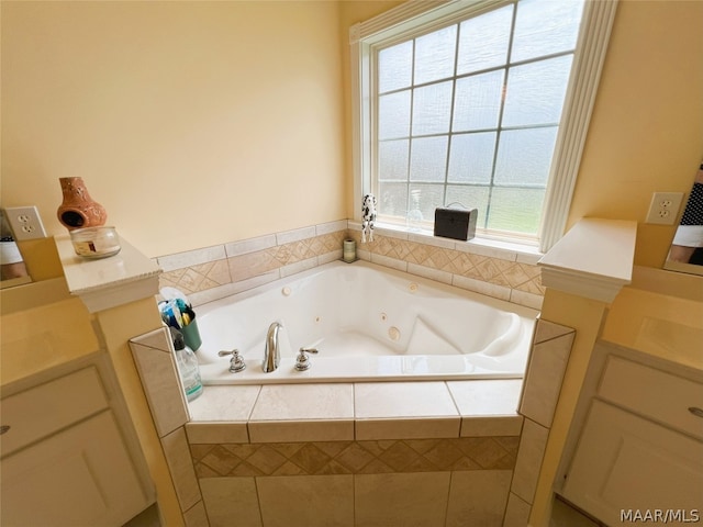 bathroom with a healthy amount of sunlight and tiled bath