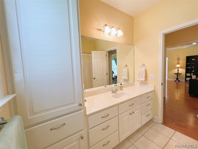 bathroom with vanity and tile patterned flooring