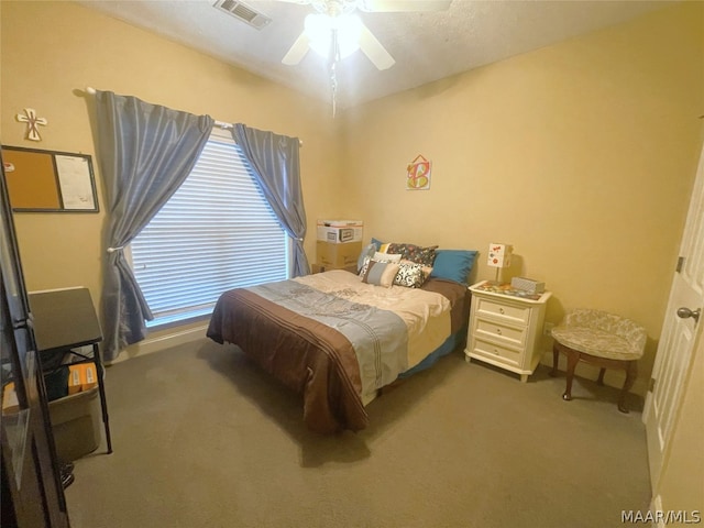 carpeted bedroom featuring ceiling fan