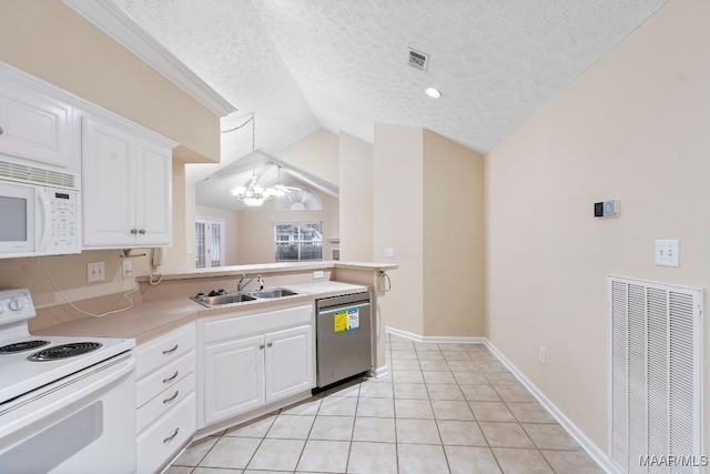 kitchen with sink, white cabinetry, white appliances, and vaulted ceiling