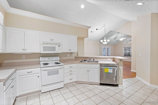 kitchen featuring white cabinetry, white appliances, vaulted ceiling, and kitchen peninsula