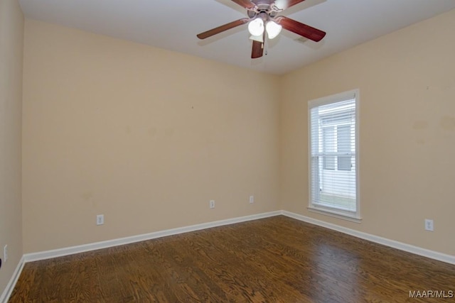 unfurnished room featuring ceiling fan and dark hardwood / wood-style floors