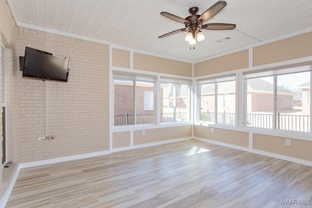 unfurnished sunroom with ceiling fan and wooden ceiling