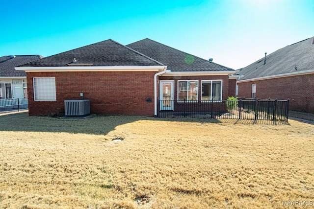 back of property featuring central AC