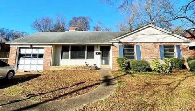 single story home with a garage