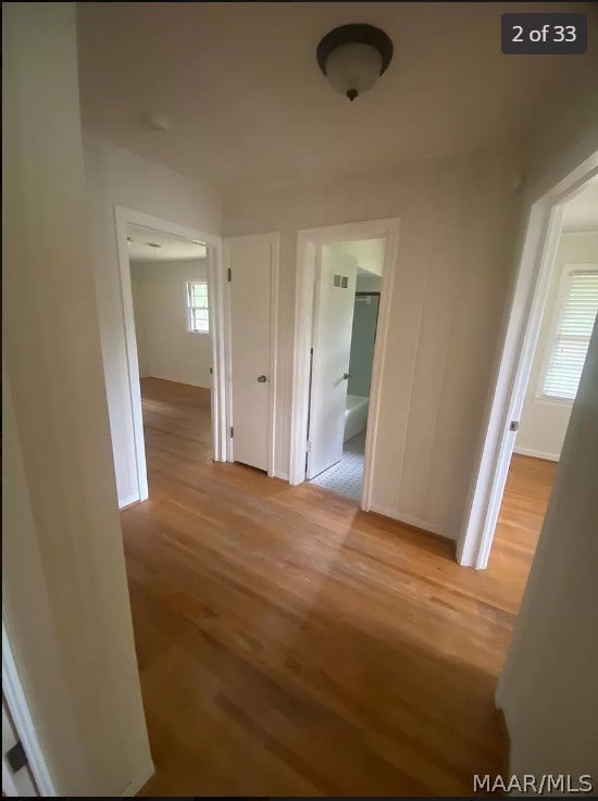 hallway with light wood-type flooring