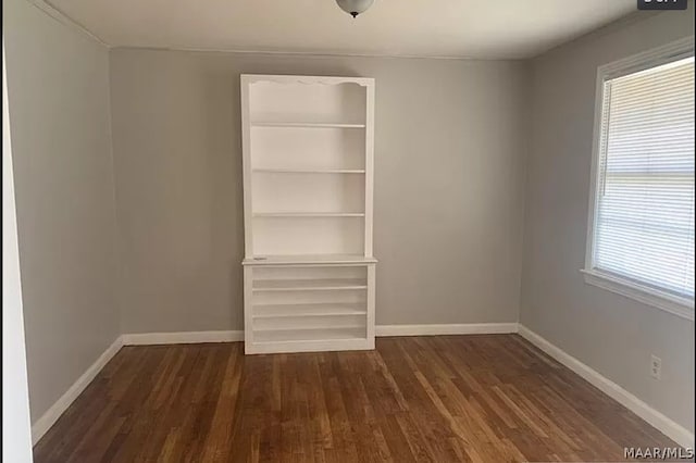 interior space with multiple windows and hardwood / wood-style flooring