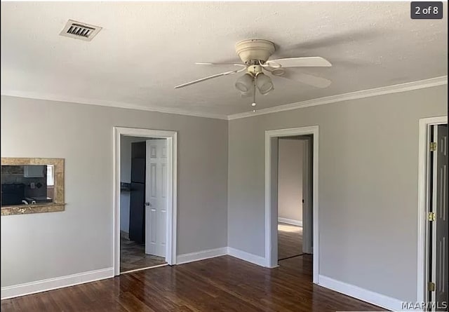 unfurnished bedroom with wood-type flooring, crown molding, and ceiling fan