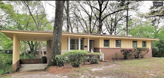 single story home featuring a carport