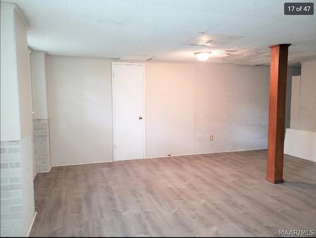 basement featuring hardwood / wood-style flooring