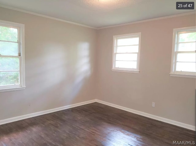 unfurnished room featuring crown molding, hardwood / wood-style flooring, and a healthy amount of sunlight