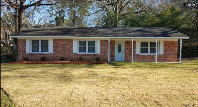 ranch-style house featuring a front lawn