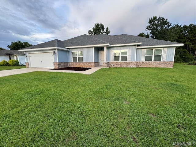 view of front of property featuring a garage and a front yard