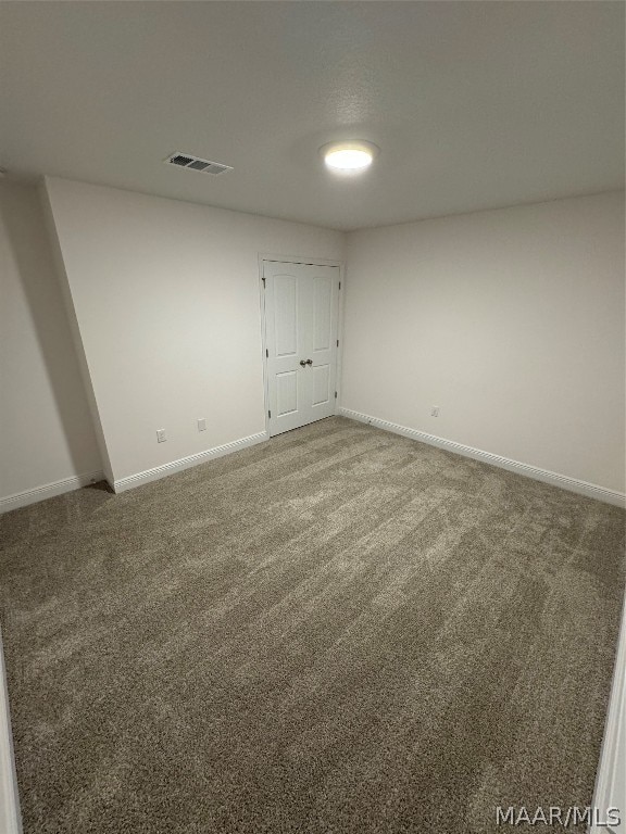 unfurnished bedroom with carpet floors