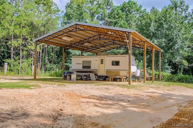 view of parking / parking lot featuring a carport