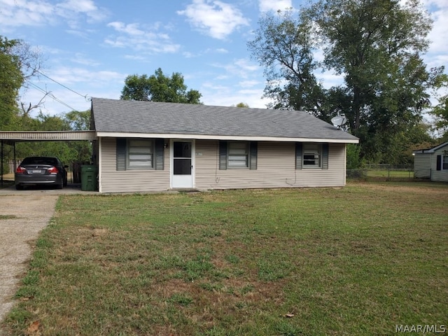 ranch-style house featuring a carport and a front yard