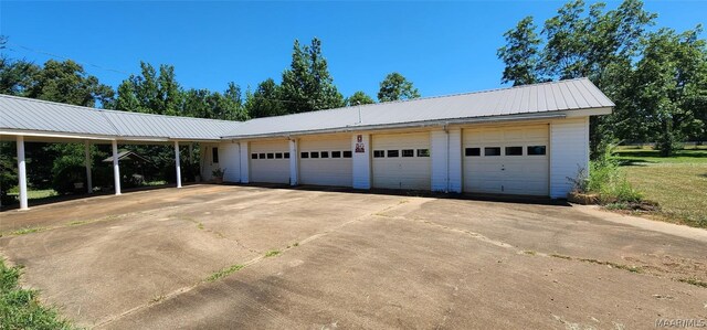 garage featuring a carport