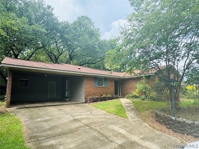 ranch-style house featuring a carport