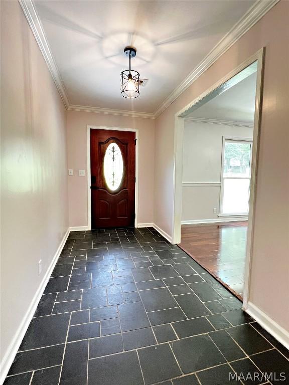 foyer featuring crown molding