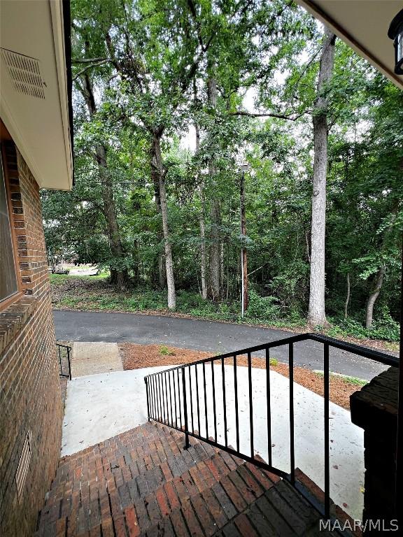 wooden deck with a patio area