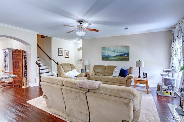 living room with crown molding, ceiling fan, and dark hardwood / wood-style flooring