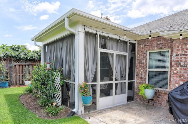 view of side of home with a patio