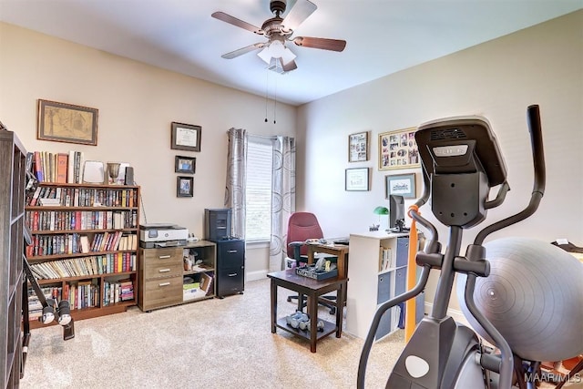 carpeted office space with ceiling fan