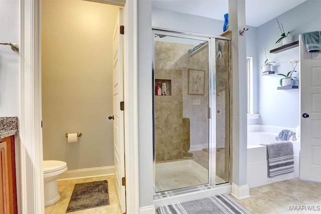 full bathroom featuring tile patterned flooring, shower with separate bathtub, vanity, and toilet