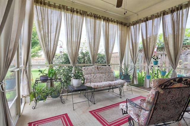 sunroom with ceiling fan