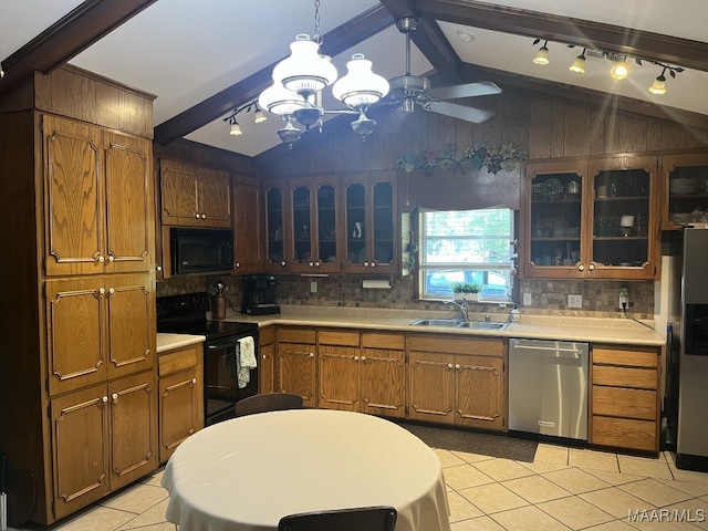 kitchen with tasteful backsplash, light tile patterned floors, black appliances, lofted ceiling with beams, and sink