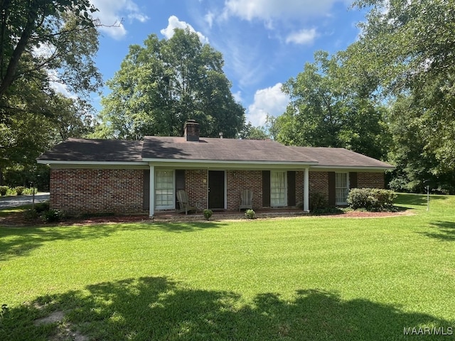 ranch-style house with a front lawn