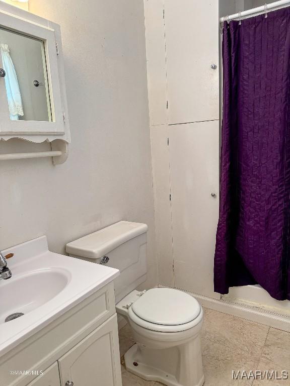 bathroom featuring vanity and toilet