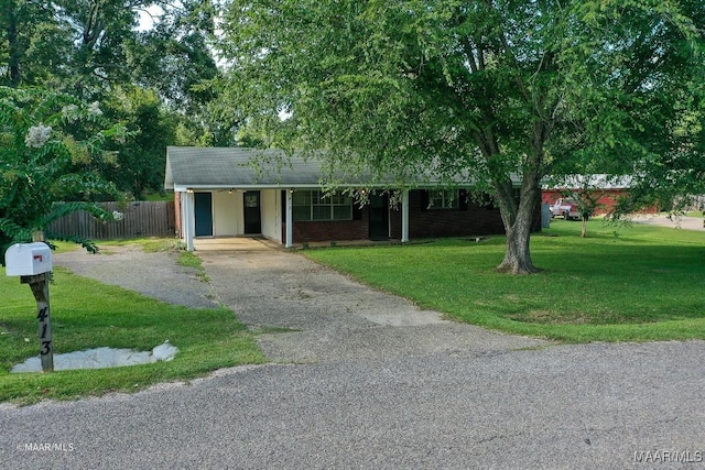 ranch-style home with a front yard