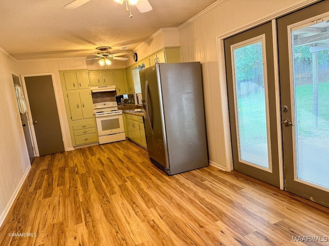 kitchen with stainless steel refrigerator, electric stove, a textured ceiling, and light wood-type flooring