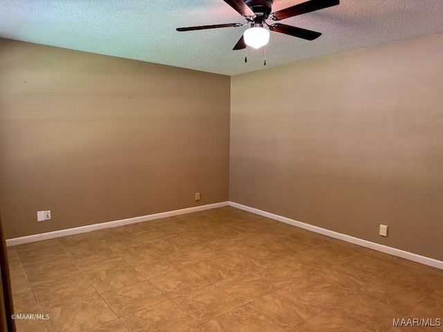 spare room with ceiling fan and a textured ceiling