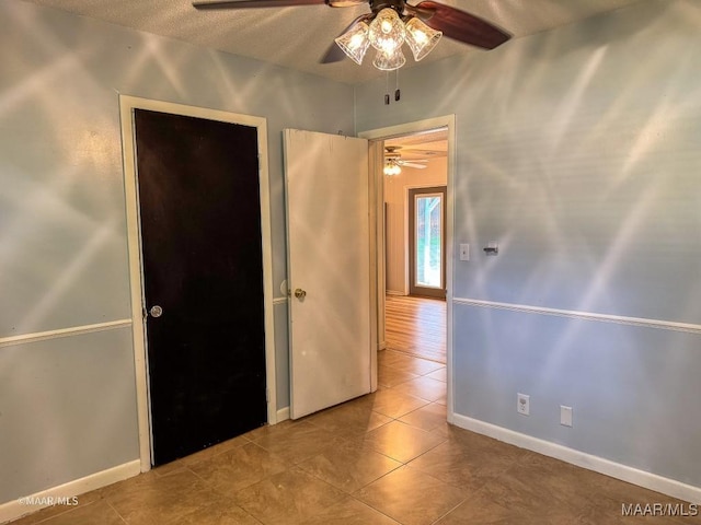 interior space featuring ceiling fan