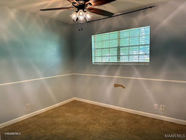 spare room with ceiling fan